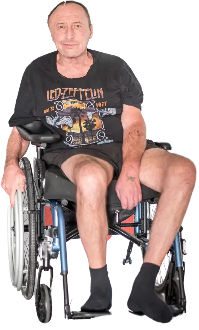 An elderly man with a disability is in a wheelchair-careassure